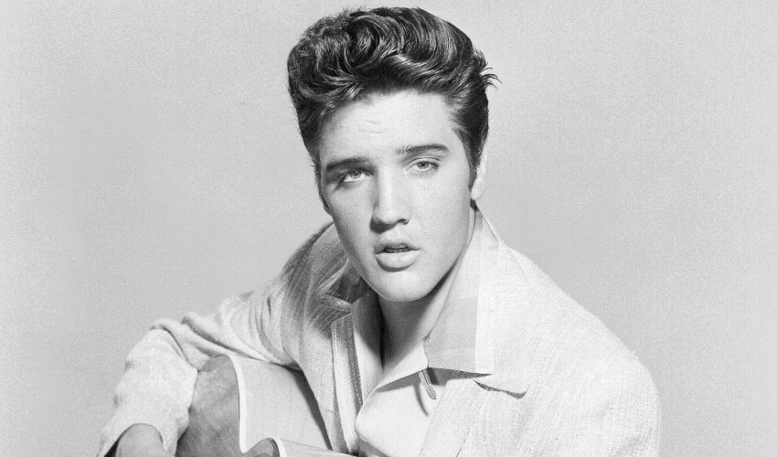 elvis-holding-a-guitar